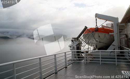 Image of Orange Lifeboat Inside Passage Sea Ocean Liner Cruise