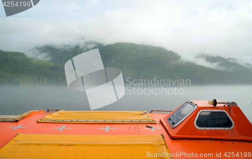 Image of Orange Lifeboat Inside Passage Sea Ocean Liner Cruise