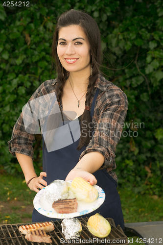 Image of Pretty Woman Smiling Cooking Steaks Barbecue Backyard Food Grill