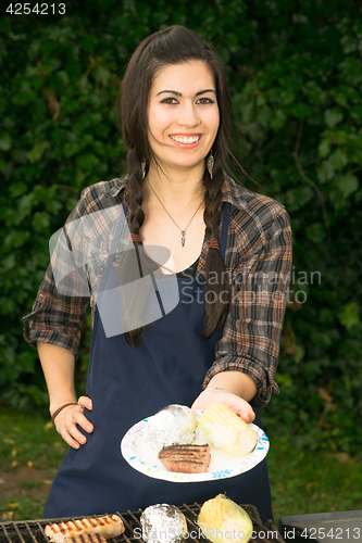 Image of Pretty Woman Smiling Cooking Steaks Barbecue Backyard Food Grill