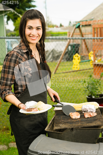 Image of Pretty Woman Smiling Cooking Steaks Barbecue Backyard Food Grill