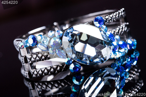 Image of Bracelet with blue stones over black