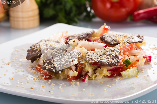 Image of salad with meat. grilled beef tongue