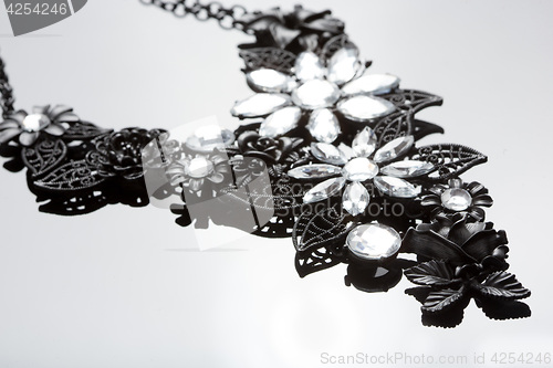 Image of necklace on gray background. large gems