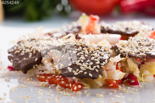 Image of salad with meat. grilled beef tongue