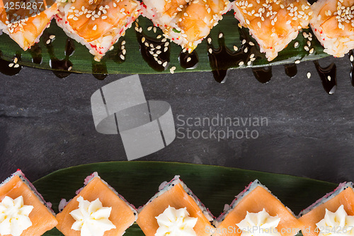 Image of set of sushi on a slate square plate. space for copy