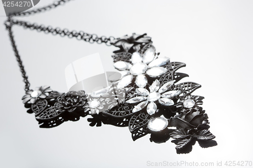 Image of necklace on gray background. large gems