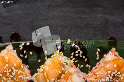 Image of set of sushi on a slate square plate. space for copy