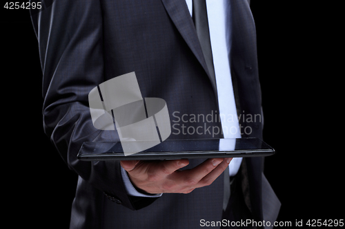 Image of business man with tablet.