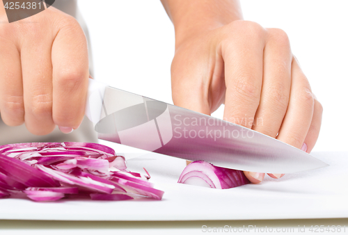 Image of Cook is chopping onion