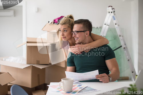 Image of Young couple moving in a new home