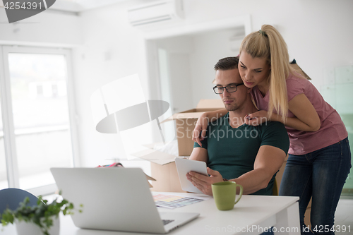 Image of Young couple moving in a new home