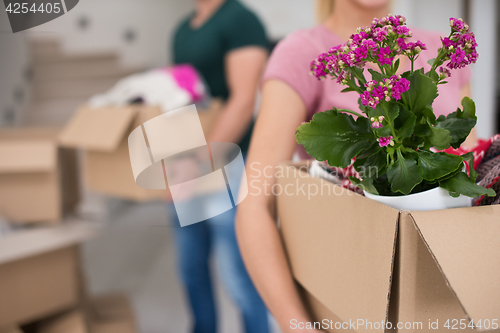 Image of young couple moving into a new home