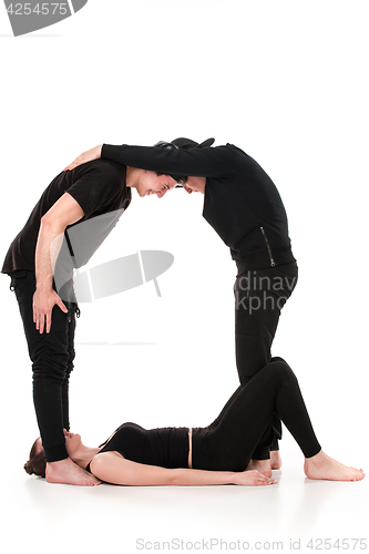 Image of The letter Q formed by Gymnast bodies