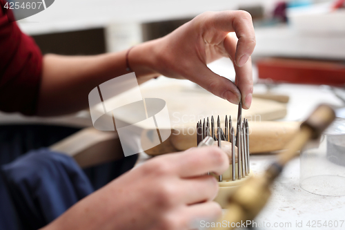 Image of Skewer binding gemstones.