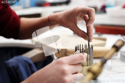 Image of Skewer binding gemstones.