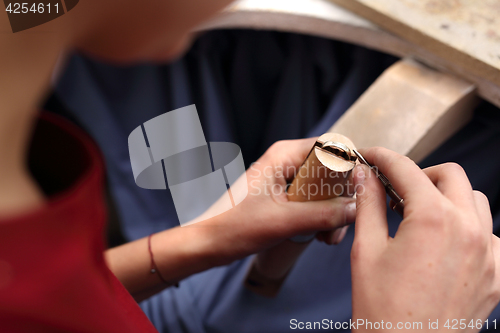 Image of Creating artistic jewelery. Jeweler at work.