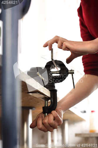 Image of Vice table in the jewelery workshop. Creating artistic jewelery. Jeweler at work.