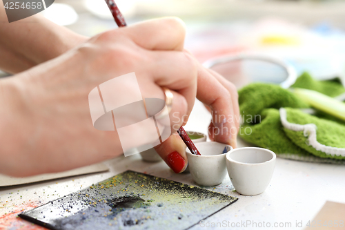 Image of Painting tiles. Hand decorated ceramic tiles.