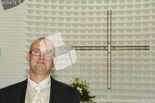 Image of Groom in church waiting
