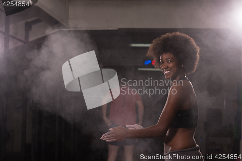 Image of black woman preparing for climbing workout