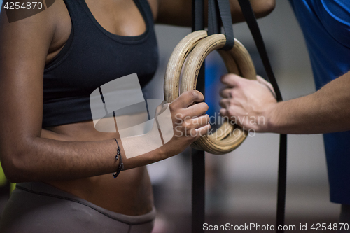 Image of Portrait of multiethnic couple  after workout at gym