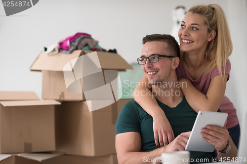 Image of Young couple moving in a new home