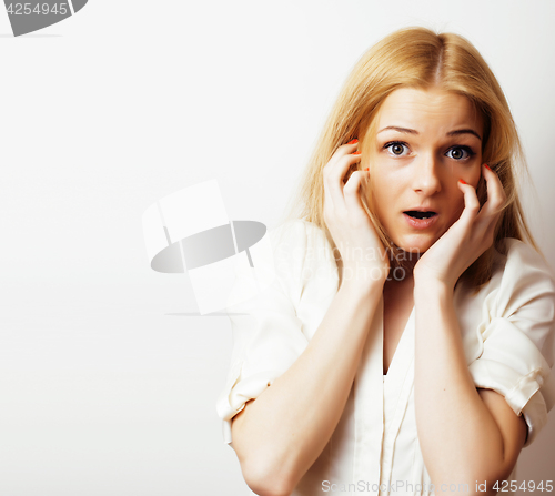 Image of young blond woman on white backgroung gesture thumbs up, isolate