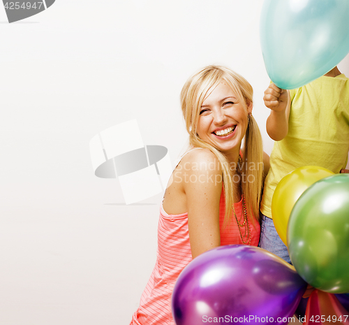 Image of pretty real family with color balloons on white background, blon