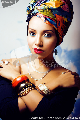 Image of beauty bright african woman with creative make up, shawl on head