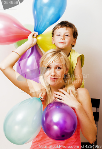 Image of pretty real family with color balloons on white background, blon