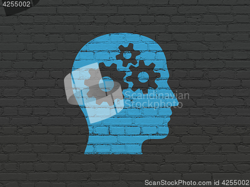 Image of Data concept: Head With Gears on wall background