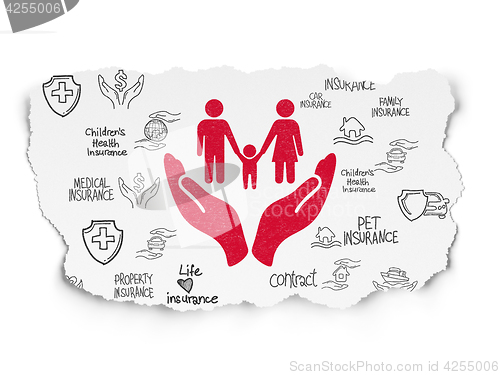 Image of Insurance concept: Family And Palm on Torn Paper background