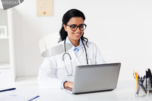 Image of female doctor with laptop at hospital