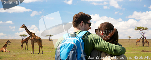 Image of happy couple with backpacks traveling