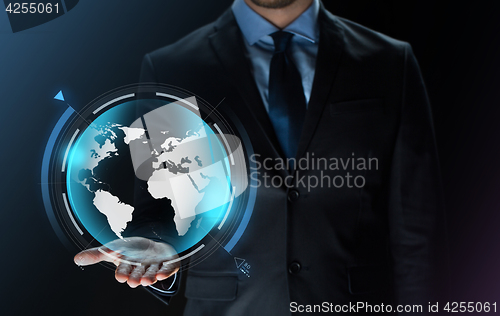 Image of close up of businessman with earth projection