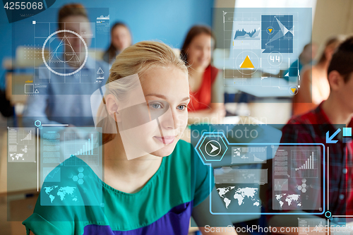 Image of teenage girl with students at school lesson