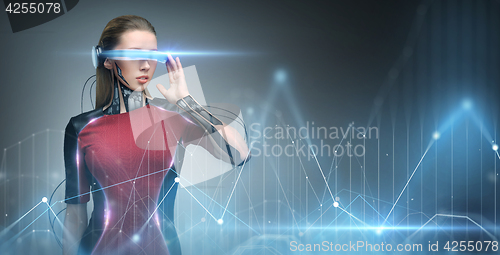 Image of woman in virtual reality glasses and microchip