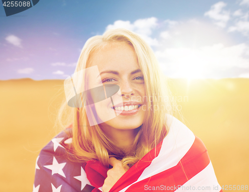 Image of happy woman in american flag on cereal field