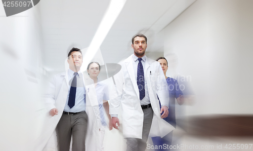 Image of group of medics walking along hospital