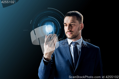 Image of businessman with transparent smartphone