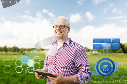 Image of senior man with tablet pc computer at county