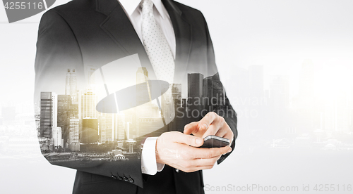 Image of close up of businessman with smartphone