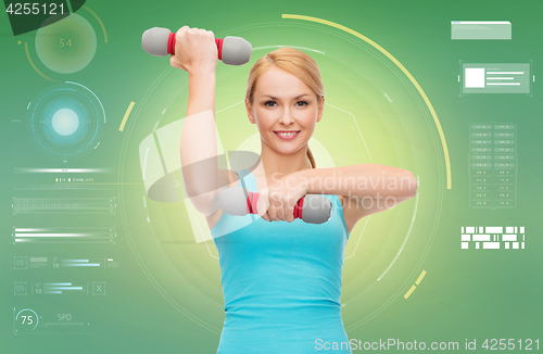 Image of happy sporty woman with dumbbells flexing biceps
