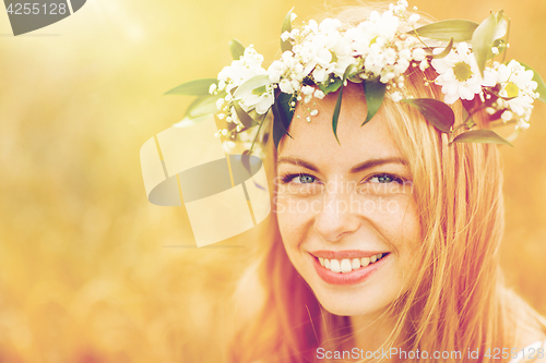 Image of happy woman in wreath of flowers