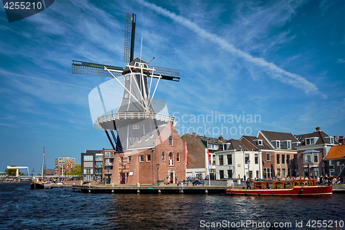 Image of Harlem landmark windmill De Adriaan on Spaarne river. Harlem,