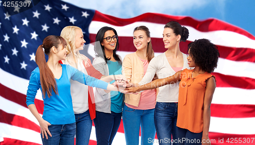 Image of united international women over american flag