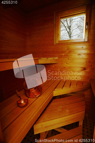 Image of interior of sauna, bucket and scoop