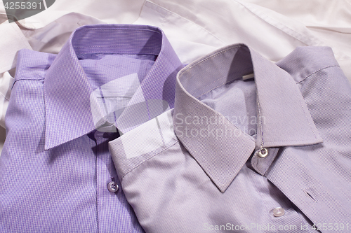 Image of Closeup of two generic shirt with a line pattern