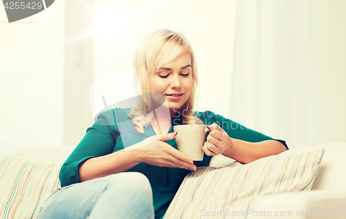 Image of happy young woman at home